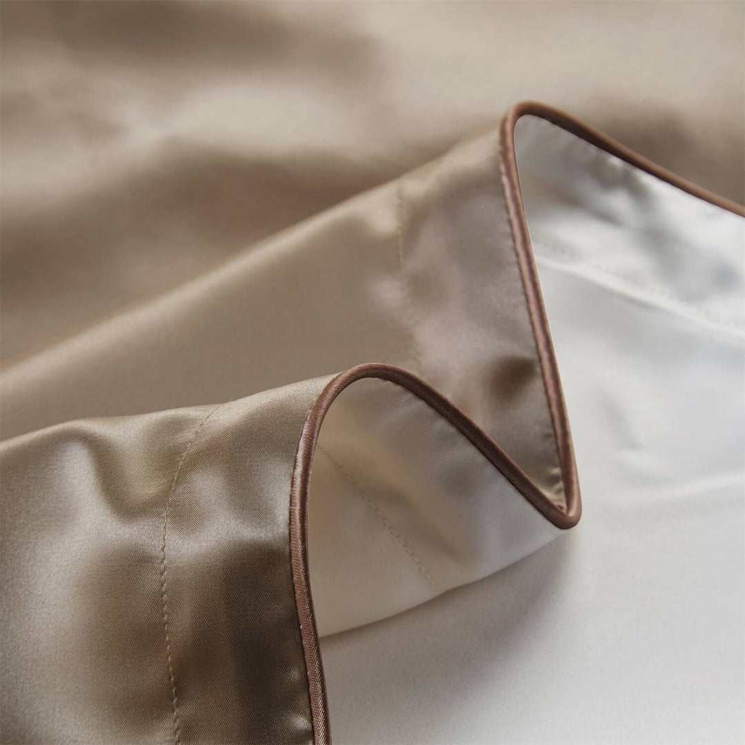 Folded pillowcase showing champagne front and white backing