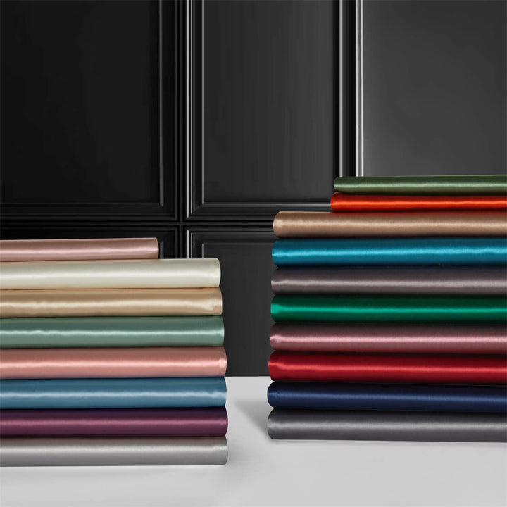 Folded pillowcase fabrics displayed in a range of colors