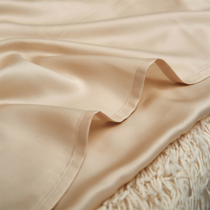 Close-up of champagne pillowcase fabric and stitched edge
